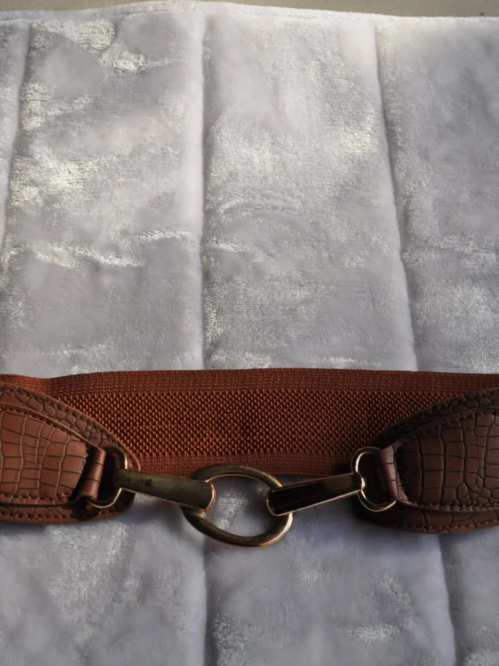 Women's brown Vince Camuto faux leather elastic wide belt features a gold circle